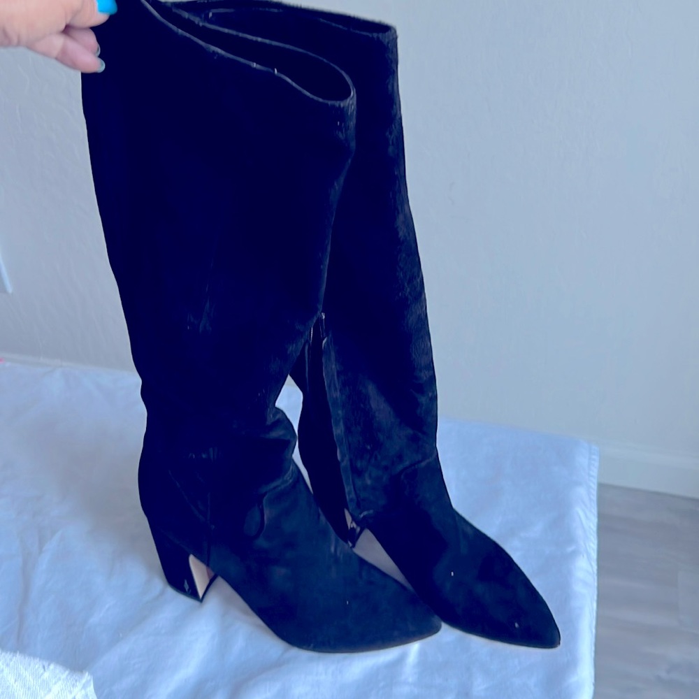Sam Edelman's boots are framed by a pointed toe and an inverted block heel